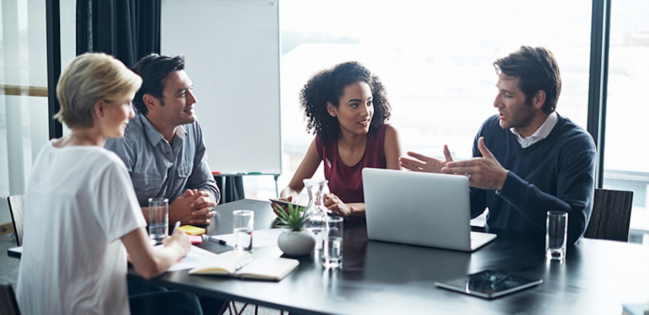 group of people discussing business at table