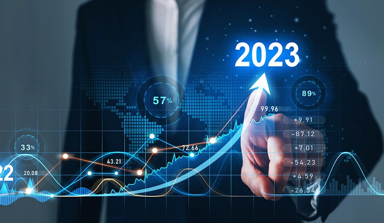 2023 Business Trends: Market Growth and Data Insights A business professional pointing at a rising digital graph showing 2023 business trends and market growth analytics.