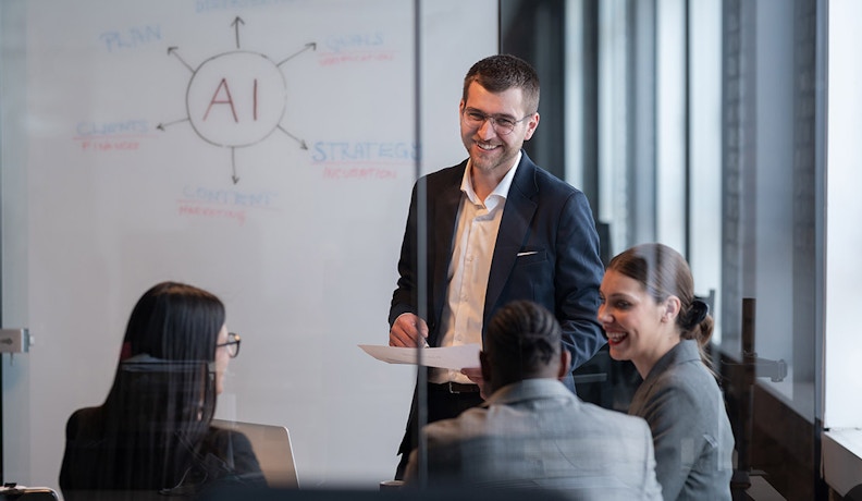 AI Strategy Meeting for Office Technology Dealers A business team discusses AI strategies on a whiteboard in a modern office, focused on office technology solutions.