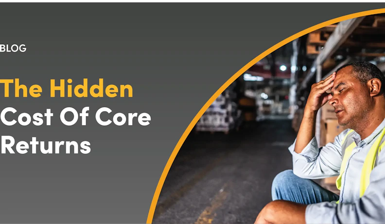 Warehouse fatigue from mismanaged core returns Stressed warehouse worker seated among boxes, hand on forehead, symbolizing core return process challenges