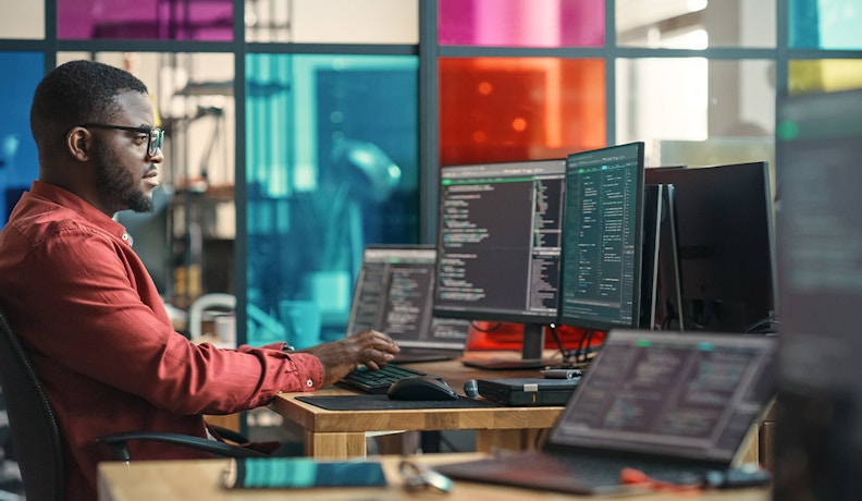 ERP solutions for Small Businesses Consultant reviewing SMB data on multiple screens