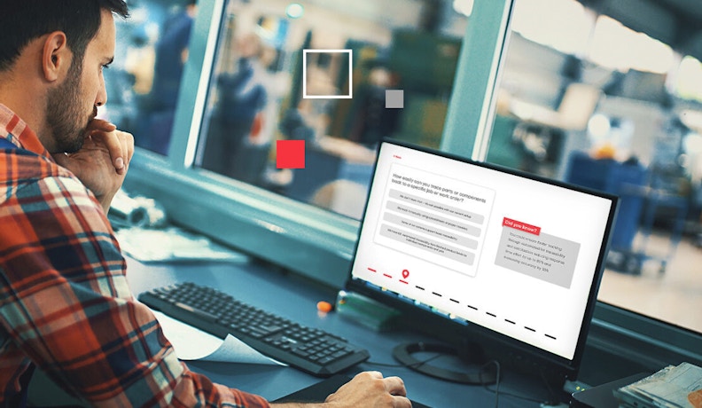Improving Operational Efficiency with ECI's Manufacturing Performance Assessment A man in a plaid shirt analyzing manufacturing operational efficiency software on a desktop computer to improve operational efficiency on a factory floor