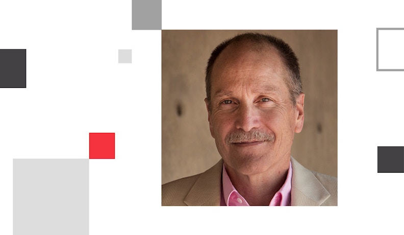 Tom Buxton, Business Supply Dealer Expert Headshot of Tom Buxton, a business supply dealer expert, in a light jacket and pink shirt.