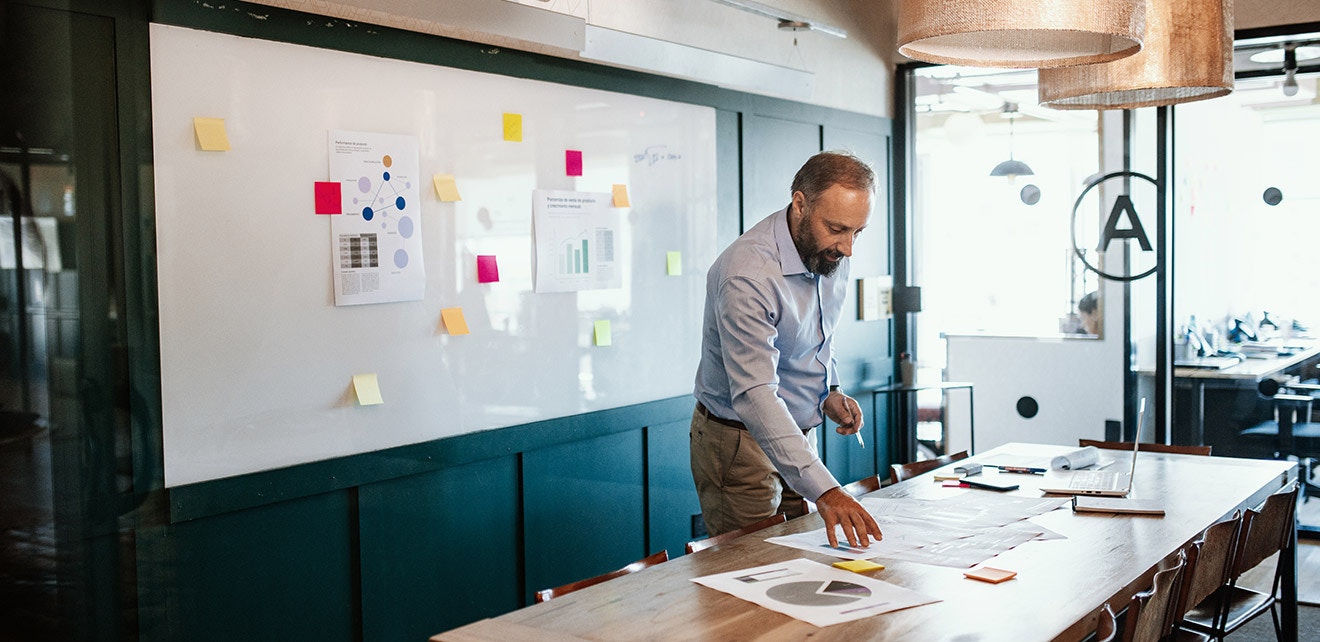 Business Leader Strategizing vs Handling Day-to-Day Tasks Small business owner focusing on strategic planning vs daily operations