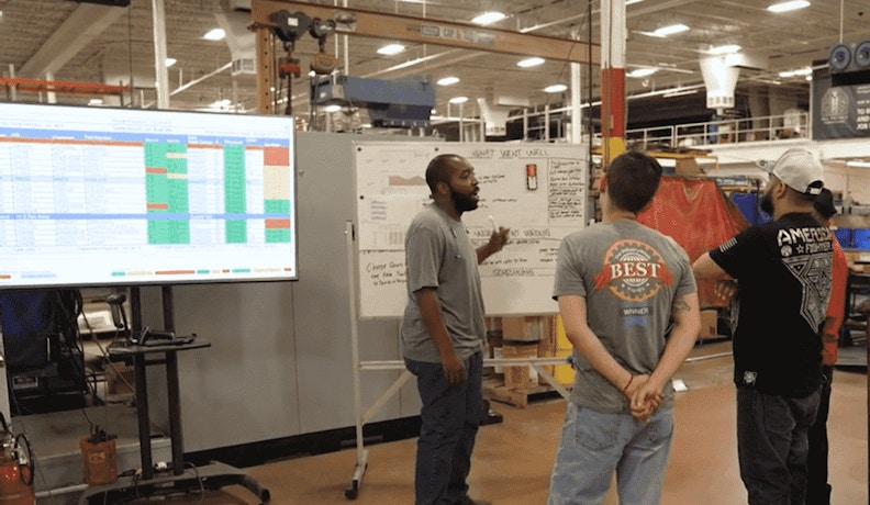 The Importance of Quality ERP consulting services ERP experts answering questions from prospects at a trade show