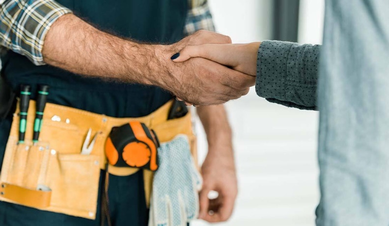 Benefits of Service Agreements for Field Service Providers Technician and customer handshake reflecting customer satisfaction