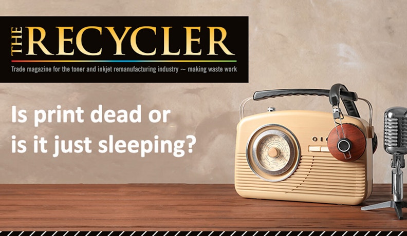 The Role of Print in a Hybrid Working Environment Poster of a legacy printer on an office desk, symbolizing the evolving print industry