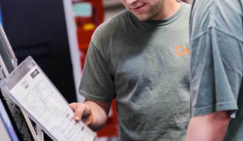 Common Machine Shop Mistakes That Impact Efficiency Machine shop team reviewing workflow processes to reduce mistakes