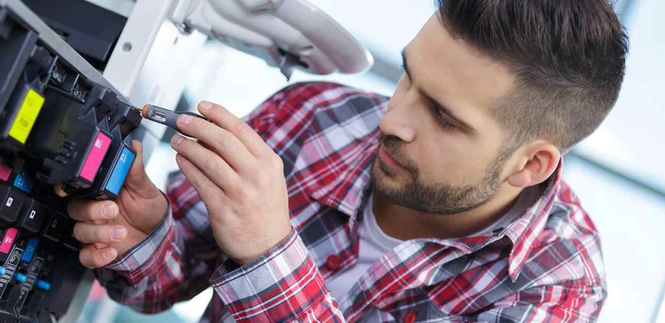 Technician Using MobileTech for Field Service Field service technician on a service call managed through MobileTech